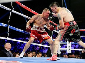 Brandon Rios (right), pins Mike Alvarado on the ropes in their second bout. The two meet in a rubber-match Saturday night. Photo: ESPN.