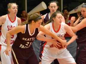 SFU's Rachel Fradgley feels the defensive heat from Seattle Pacific in GNAC women's basketball game Saturday atop Burnaby Mountain. (Steve Frost, SFU athletics)