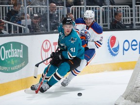 Mirco Mueller of the San Jose Sharks handles the puck against Jeff Petry of the Edmonton Oilers  December 9, 2014 at SAP Center in San Jose. (Photo by Don Smith/NHLI via Getty Images)