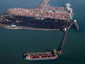 An aerial view shows the Westshore coal terminal and Deltaport container terminal at Roberts Bank. Natural resource products accounted for more than 70 per cent of goods handled by Port Metro Vancouver in 2013.