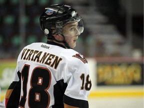 Calgary Hitmen winger Jake Virtanen, a Vancouver Canucks prospect, faces off against the visiting Vancouver Giants today in WHL action in Calgary. (Calgary Herald photo.)