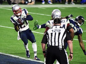 GLENDALE, AZ - FEBRUARY 01:  Malcolm Butler #21 of the New England Patriots makes an interception against the Seattle Seahawks in the fourth quarter during Super Bowl XLIX at University of Phoenix Stadium on February 1, 2015 in Glendale, Arizona.  (Photo by Harry How/Getty Images)