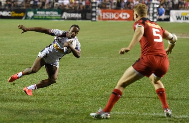  Carlin Isles of the United States avoids Conor Trainor of Canada to score a try during the USA Sevens Rugby tournament at Sam Boyd Stadium on February 14, 2015 in Las Vegas, Nevada. The United States won 20-0.  (Photo by Ethan Miller/Getty Images)