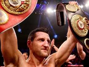 Carl Froch vacated the IBF title (red belt) in Tuesday due to injury. He is expected to defend the WBA championship in the Summer against Bernard Hopkins. Getty Images.
