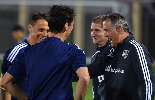 Houston coach Owen Coyle (far right) and Caps coach Carl Robinson share a laugh with the referees before Tuesday’s pre-seasonÂ match in Tucson. We’ll call this the before shot. (Marc Weber)