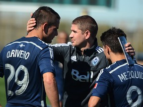 Caps coach Carl Robinson has a word with his Uruguayan attackers (Marc Weber photo)