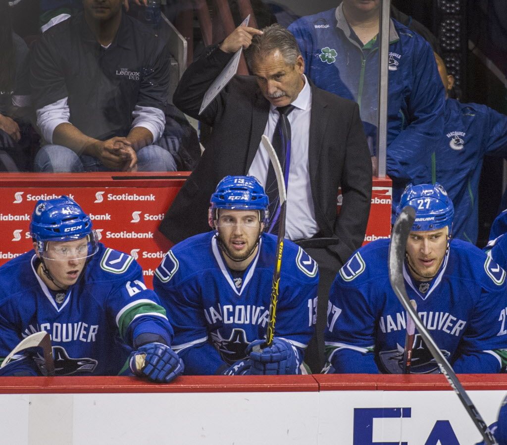 VANCOUVER. FEBRUARY 1, 2015, - Vancouver Canucks head coach Willie Desjardins scratches his head vs Minnesota Wild in NHL hockey at Rogers Arena in Vancouver B.C., February 1, 2015.   (Arlen Redekop photo / PNG staff)  (story by reporters)  00034500B                                                        [PNG Merlin Archive]