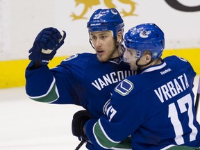 Shawn Matthias, left,  scored a hat trick on Friday in Vancouver and it was big news all the way to Calgary. (photo: Gerry Kahrmann  /  PNG)