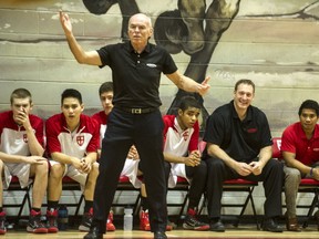 Bill Disbrow, 66, coaching his St. George's Saints senior boys varsity team earlier this season, along with his current assistant coaches (and former players) Brian Scales and Karlo Villanueva. (Steve Bosch, PNG photo)