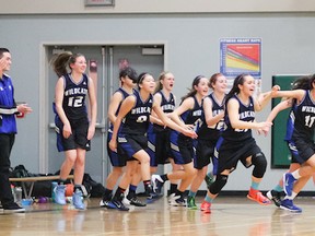 McMath head coach Anne Gillrie-Carre and her Wildcats exult after a last-second shot by Jessica Jones gave the Richmond team an upset win over the WJ Mouat Hawks in December. (Ron Hole photography)