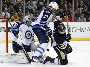 Dustin Byfuglien has always thrived against Vancouver hockey teams. (AP Photo/Gene J. Puskar)