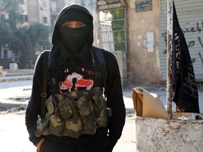 A member of jihadist group Al-Nusra Front stands in a street of the northern Syrian city of Aleppo on January 11, 2014.         (BARAA AL-HALABI/AFP/Getty Images)