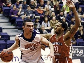 Simon Fraser Clan  forward Patrick Simon battles Western Oregon's Julian Nichols earlier this season at the West Gym. (Ron Hole, SFU athletics)