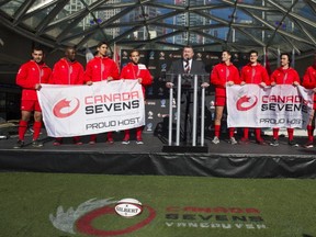 Tournament co-chair Gareth Rees, flanked by members of Rugby Canada's men's team, makes Monday's big announcement. (Richard Lam/PNG)