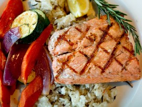 Grilled salmon with vegetables and rice is one of many delicious heart-healthy meals. — png files