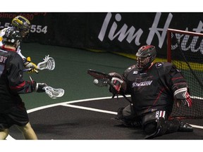 Vancouver's Tyler Richards makes a stop against the Minnesota Swarm Saturday at the LEC. Richards had a goal in 21-15 Stealth victory. ( Gerry Kahrmann, PNG)