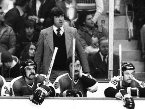 BOSTON, MA - 1970's: Pat Quinn head coach of the Philadelphia Flyers behind the bench against the Boston Bruins. (Photo by Steve Babineau/NHLI via Getty Images)