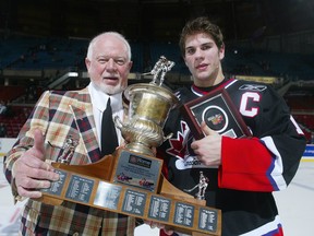 Don Cherry and Gilbert Brule of Team Cherry pose for a photo with the trophy after defeating Team Davidson in the 2005 Top Prospects game at the Pacific Coliseum.(Getty Images File/Chris Relke)