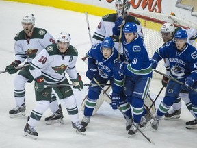 Vancouver Canucks Bo Horvat, Derek Dorsett and Ronalds Kenins in front of the Minnesota Wild goal in NHL hockey at Rogers Arena in Vancouver B.C., February 1, 2015.   (Arlen Redekop photo / PNG staff)