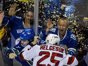 Grab the popcorn. Long-time Province photographer Ric Ernst is up for a National Newspaper Award for his photo above of Derek Dorsett duking it out with New Jersey's Seth Helgeson back in November. The nominations came out Thursday and the awards are on May 22.