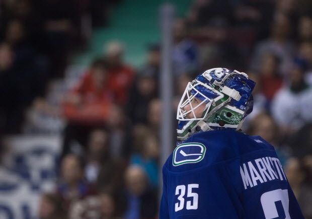 Vancouver Canucks goalie Jacob Markstrom, of Sweden, watches the replay after allowing a third goal to the San Jose Sharks during the first period of an NHL hockey game in Vancouver, B.C., on Tuesday March 3, 2015. THE CANADIAN PRESS/Darryl Dyck