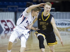 Yale's Mathew Kerc-Murchison (left) paces with Kelowna's Parker Simson during 4A BC semifinal Friday at the LEC. (Gerry Kahrmann, PNG)