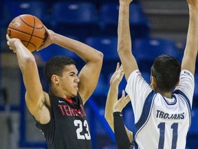 Terry Fox Ravens' Mike West (left) and David Thompson's Dilbagh Grewal clash Wednesday at the LEC. (Ric Ernst, PNG)