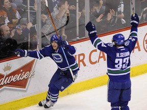 Canucks winger Alex Burrows celebrates his second of two third-period goals against the Philadelphia Flyers Thursday night. (Mark van Manen, PNG)