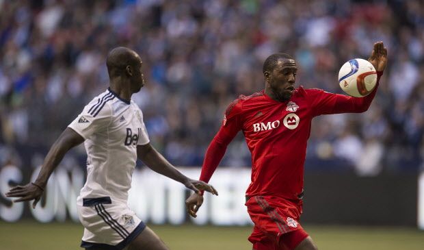 Vancouver FC defender Pa Modou Kah, left, chases after Toronto FC forward Jozy Altidore (17) during the second half of an MLS soccer game in Vancouver, B.C., on Saturday, March 7, 2015. Toronto defeated Vancouver with a score of 3-1. THE CANADIAN PRESS/Jimmy Jeong