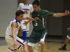 Lord Tweedsmuir's Brett Norris (right) opposes Semiahmoo's Brian Spanier during Fraser Valley Quad A semifinals last mont at Langley Events Centre. (PNG photo)