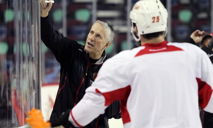 CALGARY, ; APRIL 13, 2015  -- Head coach Bob Hartley explains a drill as the Calgary Flames continue to practice hard as they head into the first round of playoffs on April 13, 2014. (Lorraine HJalte/Calgary Herald) For Sports story by . Trax # 00064193A