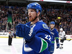 VANCOUVER, BC - APRIL 6:  Daniel Sedin #22 of the Vancouver Canucks celebrates a third-period goal against the Los Angeles Kings during their NHL game at Rogers Arena April 6, 2015 in Vancouver, British Columbia, Canada.  Vancouver won 2-1 in a shootout. (Photo by Jeff Vinnick/NHLI via Getty Images)