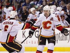 Dennis Wideman (left) and Kris Russell have helped power the Flames to a 3-1 series lead over the Canucks. (Rich Lam, Getty Images)
