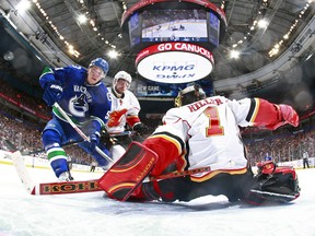 Bo Horvat drives hard to the net against Jonas Hiller in Game 1 on Wednesday. (Getty Images.)