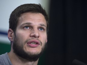 Vancouver Canucks defenceman Kevin Bieksa speaks during a news conference in Vancouver, B.C. Monday April 27, 2015. The Canucks lost their first-round NHL playoff series to the Calgary Flames in six games. THE CANADIAN PRESS/Jonathan Hayward