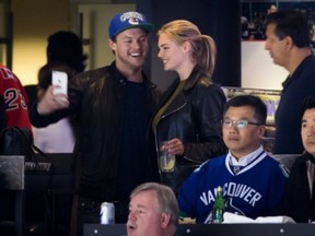 Yep, that's Kate Upton at Game 5, posing for photos with extraordinarily happy fans.