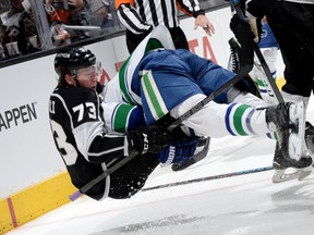 Tyler Toffoli takes down Alex Burrows during the last meeting between the Kings and Canucks on March 21. (Getty Images.)