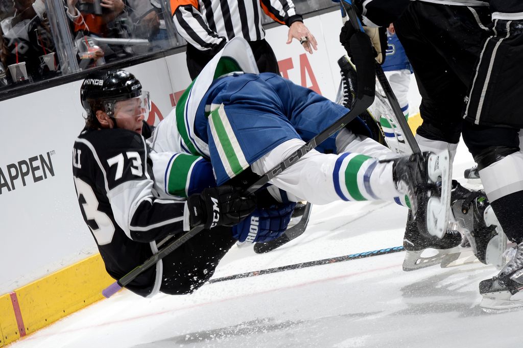 Tyler Toffoli takes down Alex Burrows during the last meeting between the Kings and Canucks on March 21. (Getty Images.)