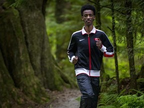 Sporting his Team Canada togs, North Surrey's Nathan Tadesse puts in some light mileage Tuesday at Tynehead Regional Park. (Ric Ernst, PNG photo)