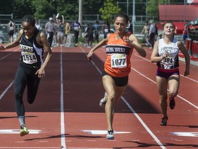 New Westminster Hyacks' Raquel Tjernagel (centre) beats St. Thomas More's Zion Corrales-Nelson in the Subway B.C. high school 100-metre final last season in Langley. (Steve Bosch, PNG file photo)