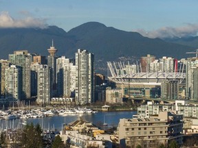The downtown Vancouver skyline as seen on Jan. 28, 2015. What does your neighbourhood say about you? A new online tool profiles your postal code. Ric Ernst/PNG