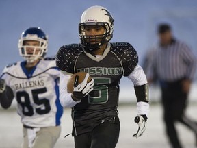 Mission's Jesse Walker sprints for a TD in last season's epic battle against Ballenas at UBC Thunderbird Stadium. (PNG file photo)