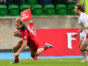 Harry Jones of Canada scores a try in the first half during the Emirates Airlines Rugby 7s match between Canada and England at Scotstoun Stadium on May 10, 2015 in Glasgow, Scotland. (Photo by Mark Runnacles/Getty Images)