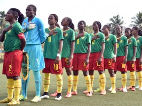 Cameroon's players sing their national anthem before a women friendly football match between Cameroon and Ivory Coast on May 10, 2015 at the Robert Champroux stadium in Abidjan, ahead of the FIFA women World Cup Canada 2015.  (ISSOUF SANOGO/AFP/Getty Images)