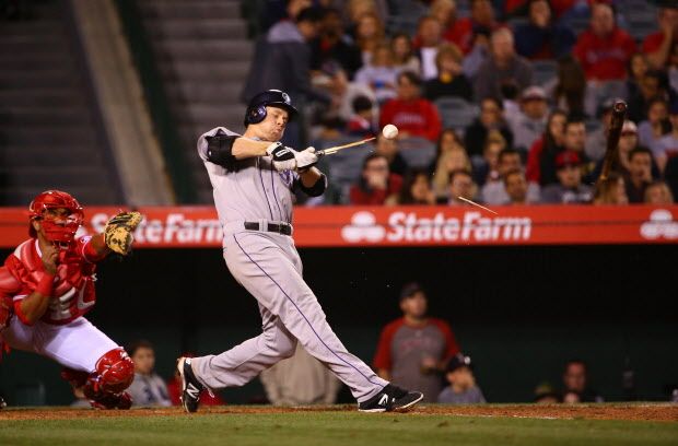 ANAHEIM, CA - MAY 12:  Justin Morneau #33 of the Colorado Rockies breaks his bat during his at-bat in the sixth inning during the MLB game against the Los Angeles Angels of Anaheim at Angel Stadium of Anaheim on May 12, 2015 in Anaheim, California.  (Photo by Victor Decolongon/Getty Images)