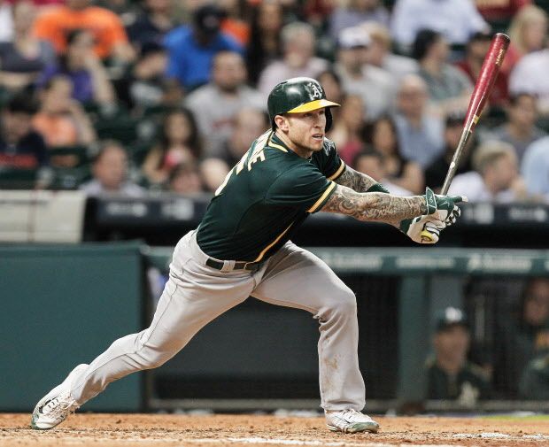 HOUSTON, TX - MAY 18:  Brett Lawrie #15 of the Oakland Athletics singles to right field in the sixth inning against the Houston Astros at Minute Maid Park on May 18, 2015 in Houston, Texas.  (Photo by Bob Levey/Getty Images)