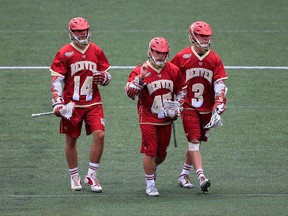 Wesley Berg (14) and Tyler Pace (3), shown here in 2014 with Jeremy Noble, helped Denver to a spot in the NCAA finals on Saturday. (Getty Image File.)