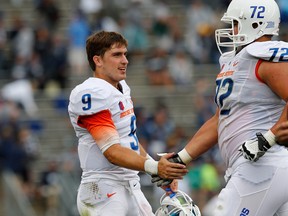 Former Boise State pivot Grant Hedrick is one of a cast of thousands in Lions camp who may fill the backup spots to Travis Lulay. (Photo by Jim Rogash/Getty Images)