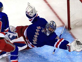 Henrik Lundqvist lunges for the puck that killed the Rangers in last night's Game 2 against Tampa Bay. That was Alex Killorn off a slap pass from Victor Hedman.