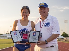 UBC's double-gold national champ Maria Bernard shares a moment with 'Birds head coach Marek Jedrzejek on Saturday in Alabama at the NAIA nationals. (Wilson Wong, UBC athletics)